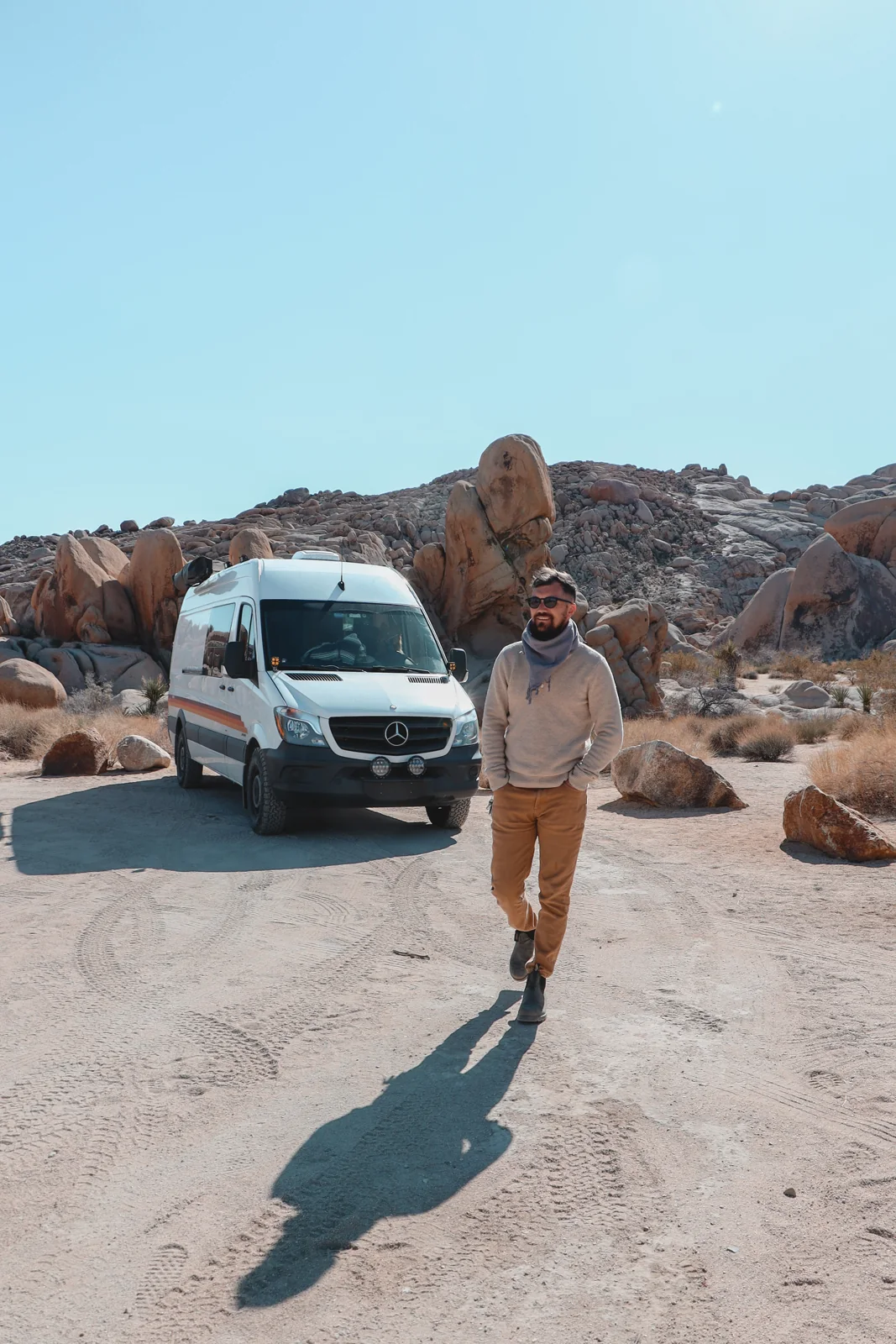 Chase standing beside a No Coast van.