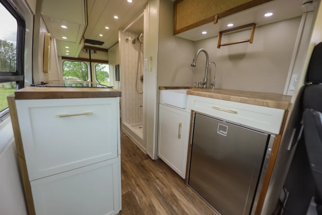 Cabinetry, woven upper doors, and an open central aisle.